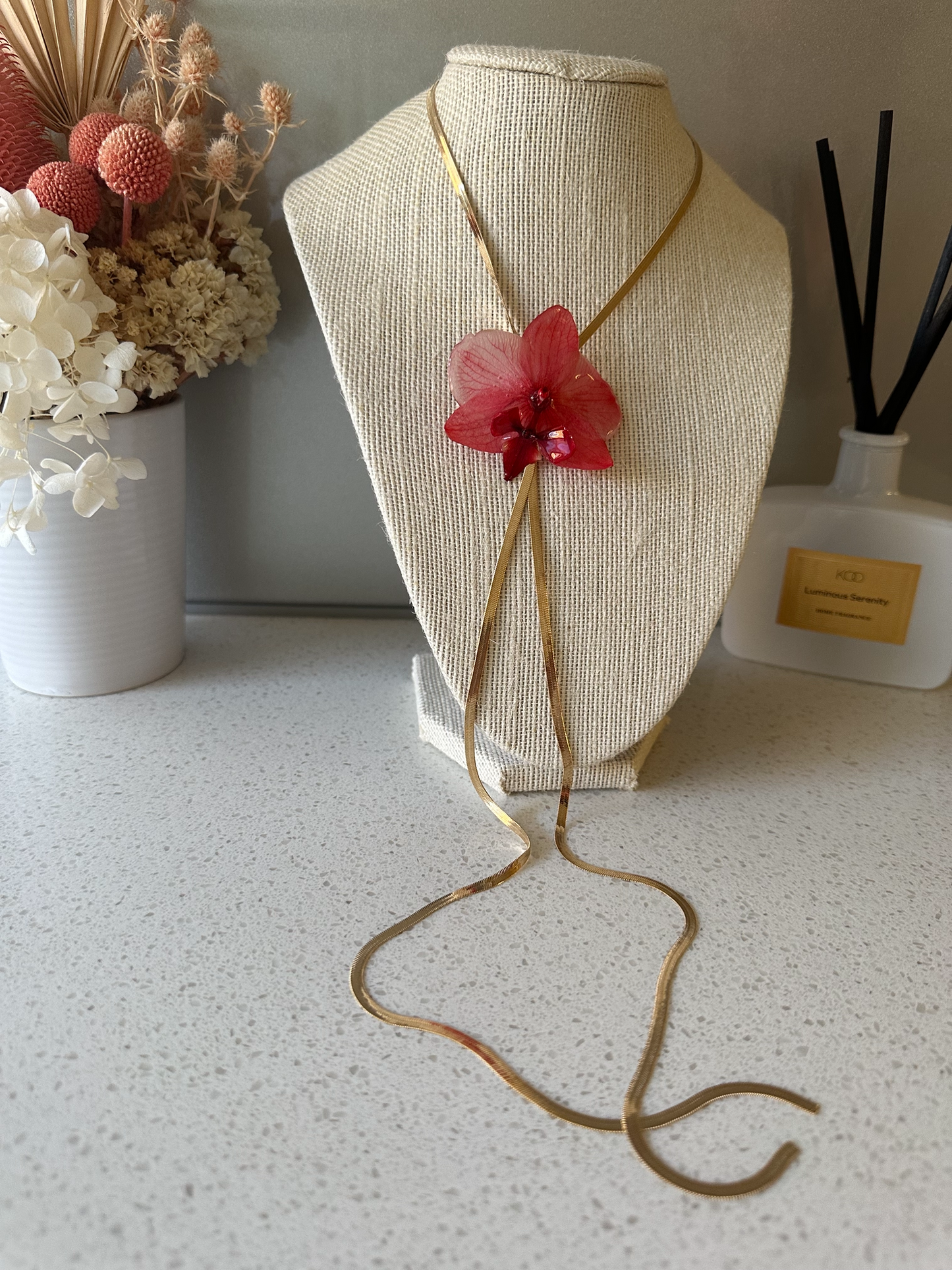 Red orchid on snake bone sliding chain