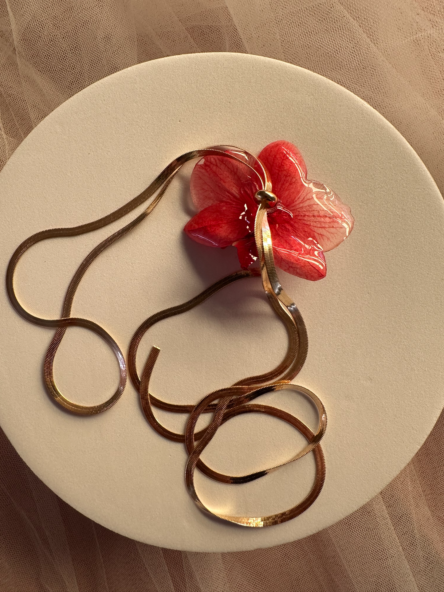 Red orchid on snake bone sliding chain