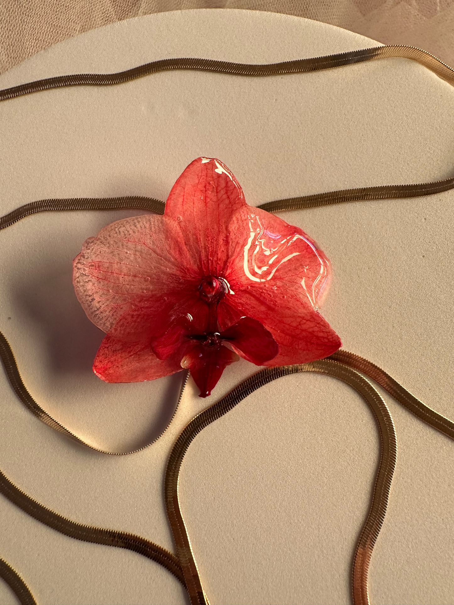 Red orchid on snake bone sliding chain