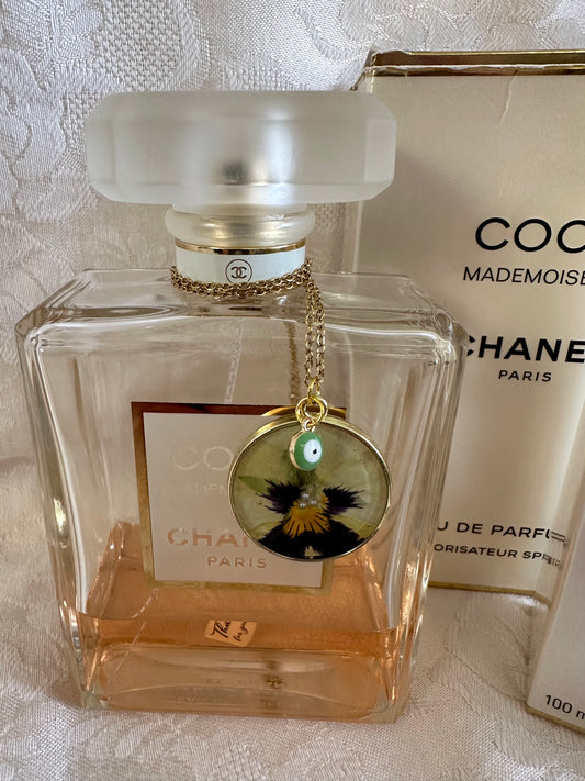 Yellow pansy with evil eye