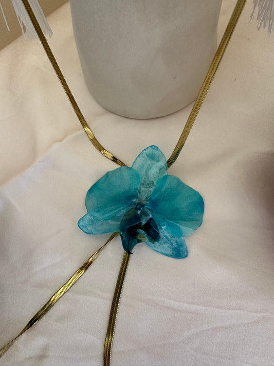 Blue orchid on gold sliding necklace
